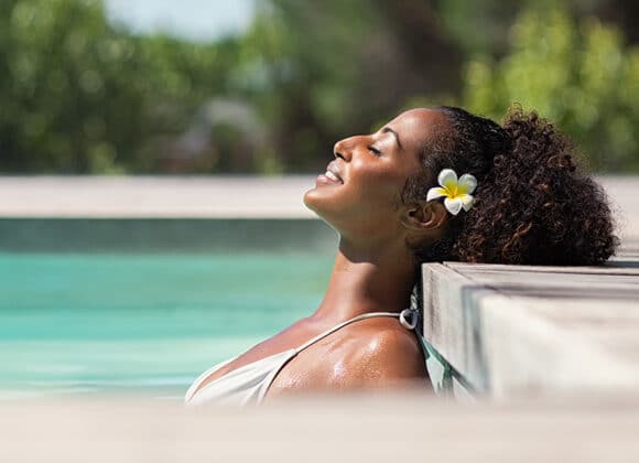 Woman relaxing in a pool.