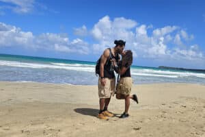 Couple kissing on the beach at Playa Esmeralda.
